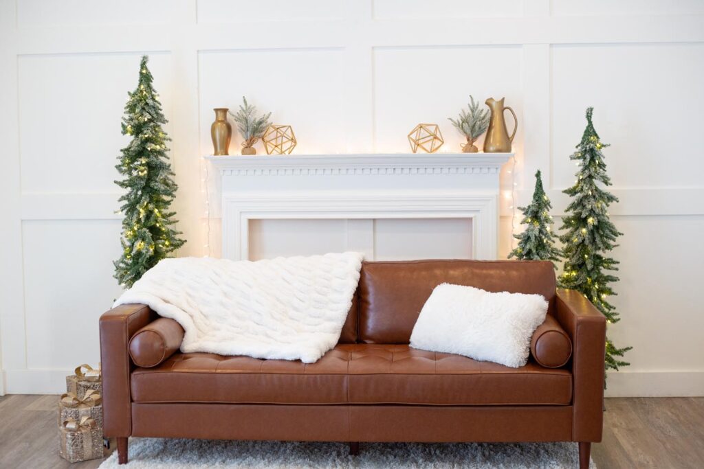 Tasteful holiday setting with hearth and couch